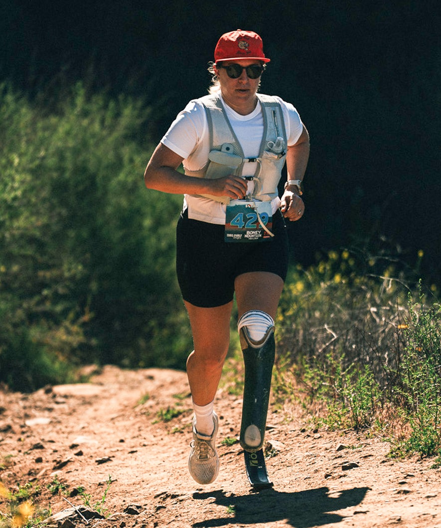 Danielle McLaughlin runs up a hill on a trail run.